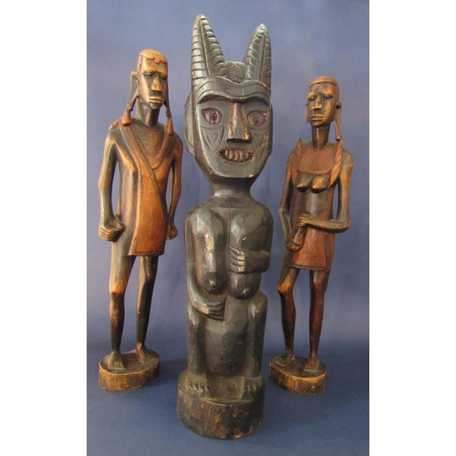 542 - Tribal interest - carved ebonised wooden study of a demonic type character, 66 cm high, together wit... 