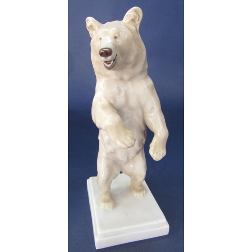 98 - Meissen porcelain study of a standing brown bear, upon a stepped square base, cross swords mark and ... 