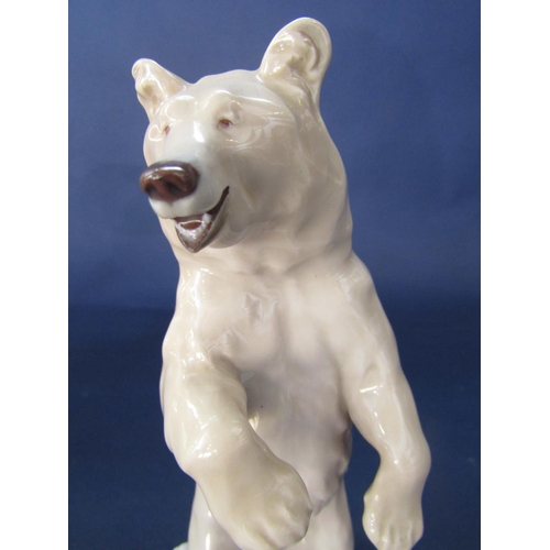 98 - Meissen porcelain study of a standing brown bear, upon a stepped square base, cross swords mark and ... 