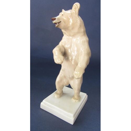 98 - Meissen porcelain study of a standing brown bear, upon a stepped square base, cross swords mark and ... 