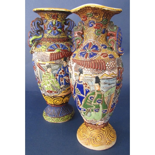 99 - Matched pair of Japanese Satsuma twin handled baluster vase with relief enamel decoration of figures... 