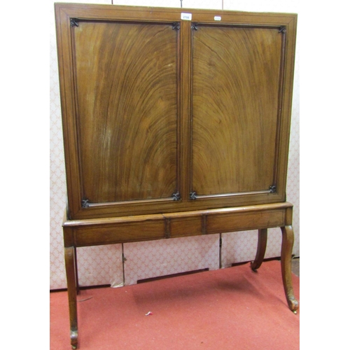 2168 - A Regency mahogany folio or print stand, raised on four swept supports, with panelled frame and well... 