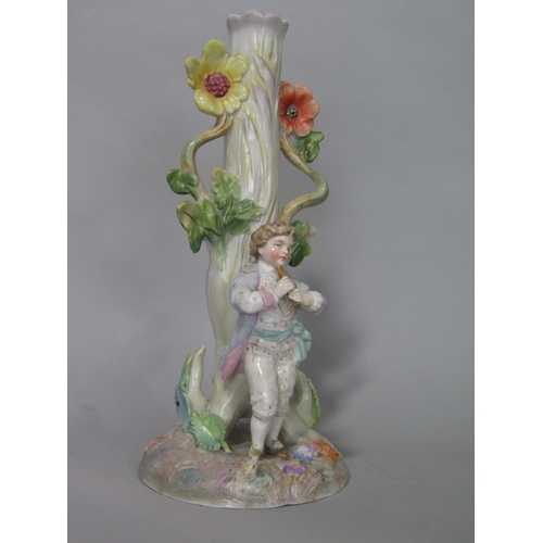 100 - A late 19th century German porcelain three branch candelabra with a piper standing beneath a tree, t... 