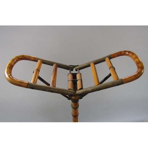 515 - A good quality bamboo shafted shooting stick with typical folding seat to the top, together with fur... 