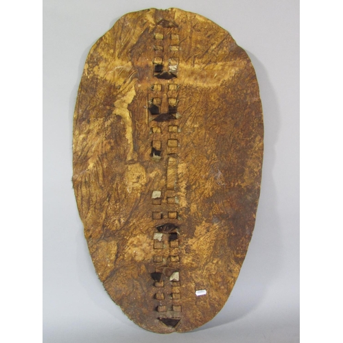 545 - Tribal interest - hide covered drum, 27 cm high, together with a further hide shield 79 cm long (2)