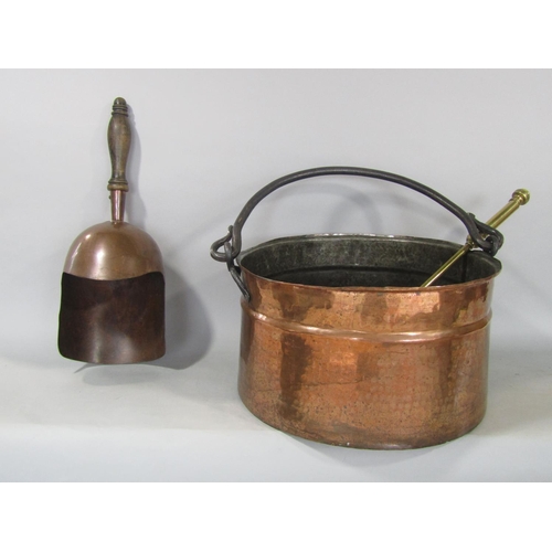 579 - Planished copper log bin together with a further coal scoop and brass fire iron (3)