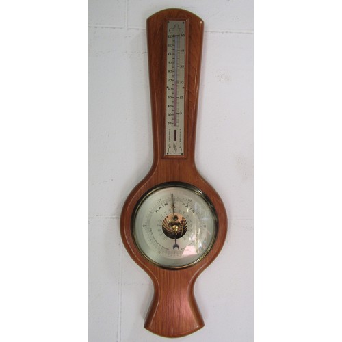 583 - A 'Bristol' kitchenware green ground cog mixing bowl and a modern barometer