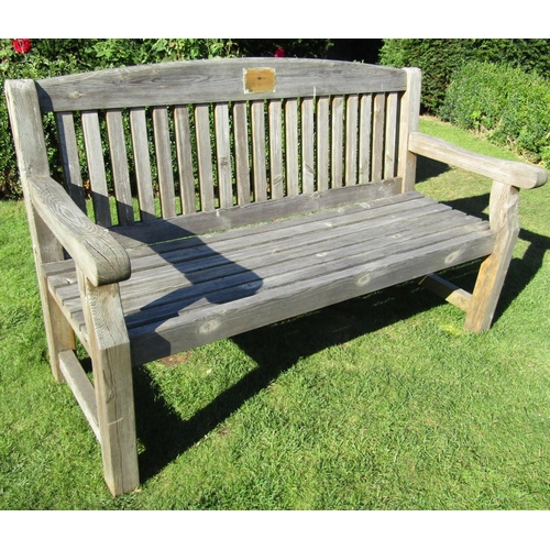 85 - A weathered pine garden bench with slatted seat and back, 155cm long