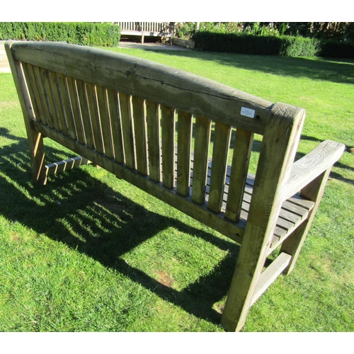 85 - A weathered pine garden bench with slatted seat and back, 155cm long