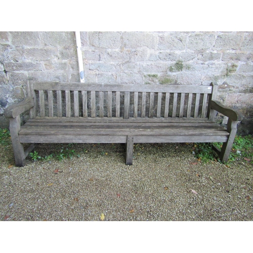 87 - A good quality teak garden bench, 240cm long approx