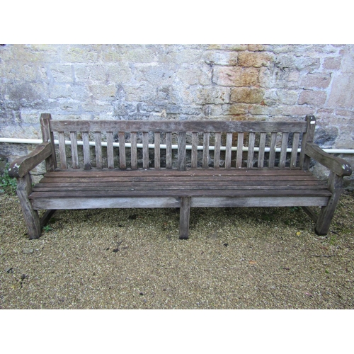 88 - A good quality teak garden bench, 240cm long approx