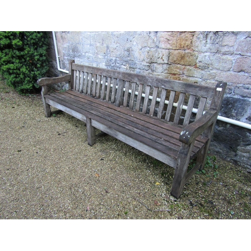 88 - A good quality teak garden bench, 240cm long approx