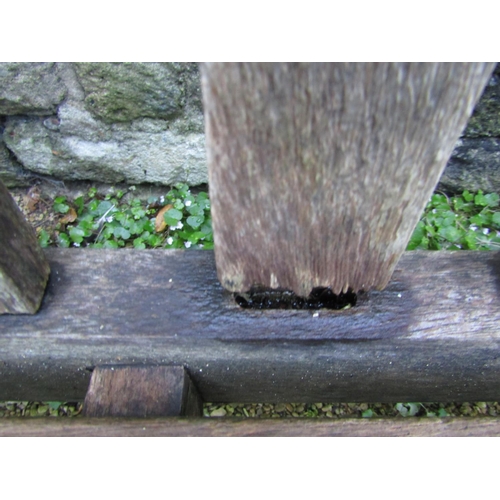 88 - A good quality teak garden bench, 240cm long approx