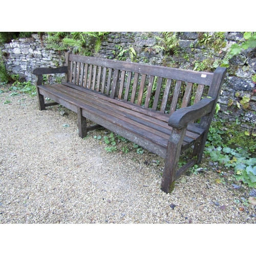 89 - A good quality teak garden bench, 240cm long approx