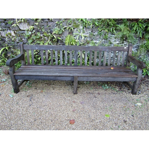 90 - A good quality teak garden bench, 240cm long approx