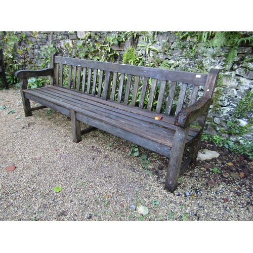 90 - A good quality teak garden bench, 240cm long approx