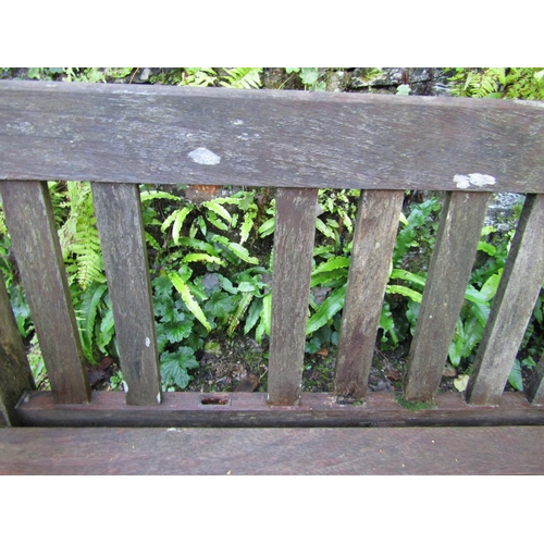 90 - A good quality teak garden bench, 240cm long approx