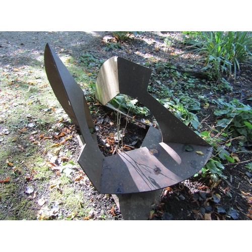 91 - An iron sculpture of angular construction, 120cm x 90cm x 63cm approx