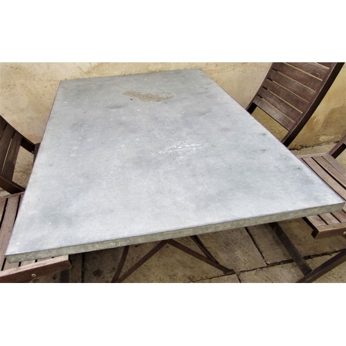 65a - A vintage style café table, the rectangular top zinc lined, 120cm x 80cm, raised on an ironwork base