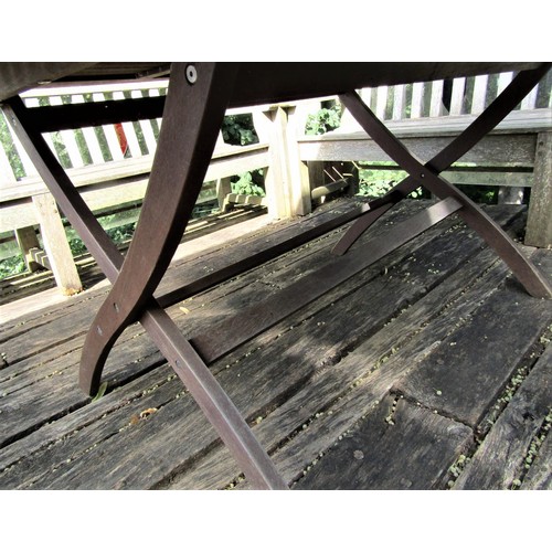 73 - A good quality weathered teak garden table with slatted top and folding x shaped frame, 155cm x 95cm... 