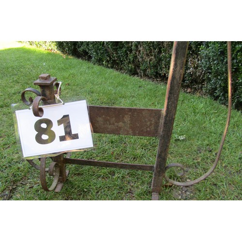 81 - An ironwork boot scraper with crook handle and further scrolling detail