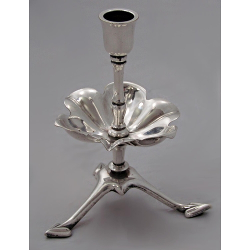 159 - WAS Benson silver plated candlestick, the raised sconce over a flower petal drip tray, upon triform ... 