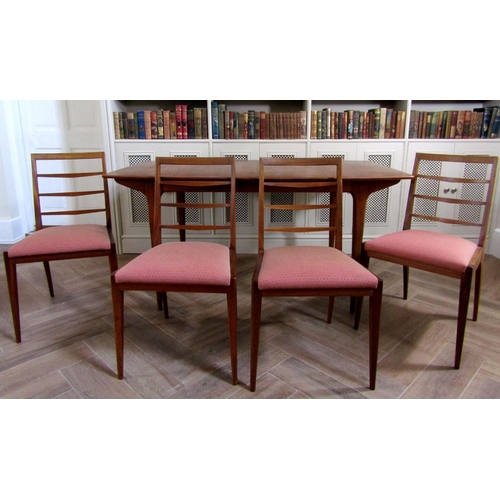 220 - McIntosh teak extending dining table and four ladderback chairs, the table 75cm high x 152cm long