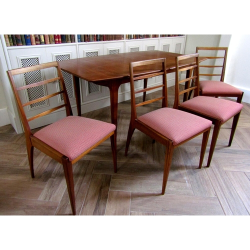 220 - McIntosh teak extending dining table and four ladderback chairs, the table 75cm high x 152cm long