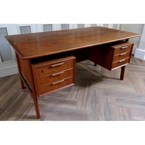 221 - Gunni Omann teak twin pedestal desk, the floating top over two pedestals fitted with three short dra... 