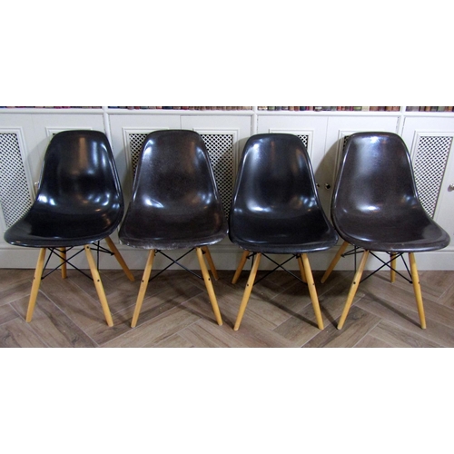 223 - Set of four Eames style Eiffel dining chairs with charcoal fiberglass moulded seats upon four beech ... 