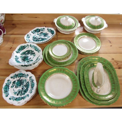 1103 - A collection of Ashworth Brothers ironstone dinnerwares with green and gilt border decoration compri... 