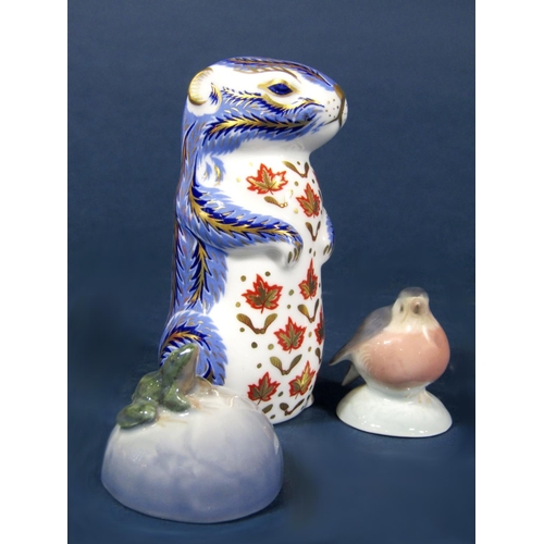 1064 - A Royal Crown Derby imari type paperweight in the form of a chipmunk, together with two Royal Copenh... 