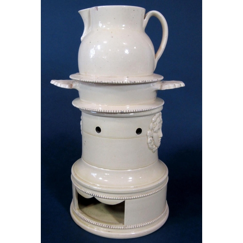 1080 - An early 19th century creamware three sectional veilleuse together with burner with moulded female c... 