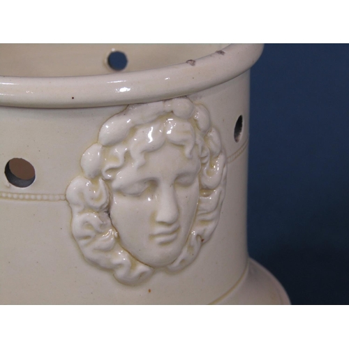 1080 - An early 19th century creamware three sectional veilleuse together with burner with moulded female c... 