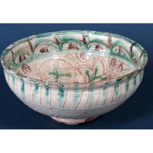 1084 - A Turkish/Islamic Sgraffitto type pottery bowl, with green and brown incised decoration, 19cm approx... 