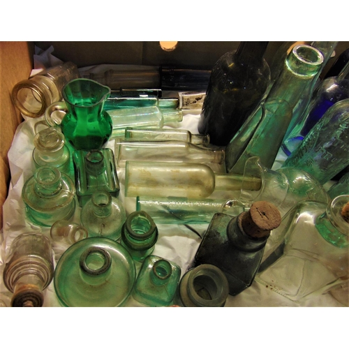 1140 - A mixed collection of various antique and vintage glass advertising and collectors bottles