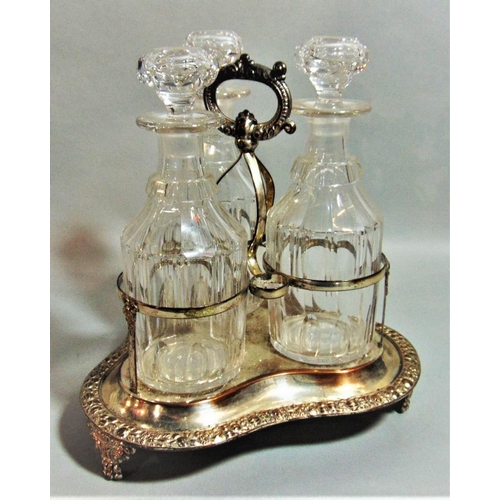 1173 - Good quality antique silver plated three decanter bottle cruet, the frame with scrolled acanthus and... 