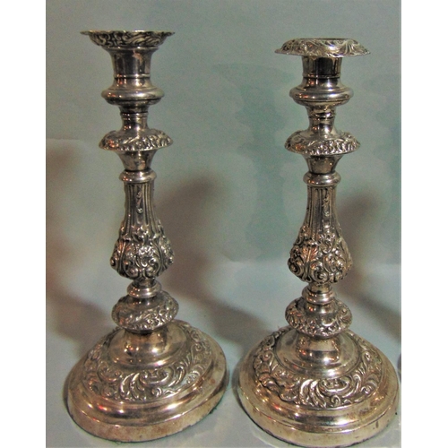 1176 - Pair of antique good quality Sheffield plated candlesticks, the baluster columns with cast acanthus ... 