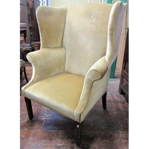 2753 - A 19th century mahogany wing drawing room chair with scrolled arms raised on square tapered forelegs