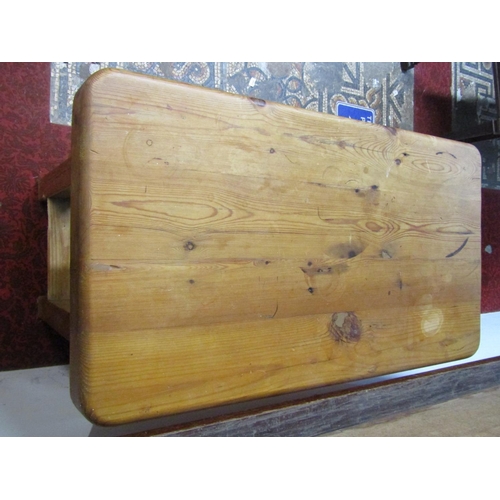 2767 - A traditional pine butchers or kitchen block, the heavy plank top over a deep frieze drawer raised o... 