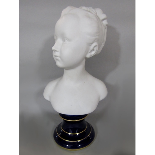 529 - Tharaud for Limoges France bisque porcelain bust of a girl upon a cobalt blue gilt plinth, 39cm high