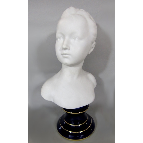 529 - Tharaud for Limoges France bisque porcelain bust of a girl upon a cobalt blue gilt plinth, 39cm high