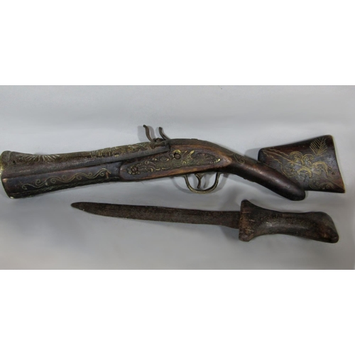 533 - Antique Albanian dagger with primitive wooden handle, together with an eastern blunderbuss type flin... 