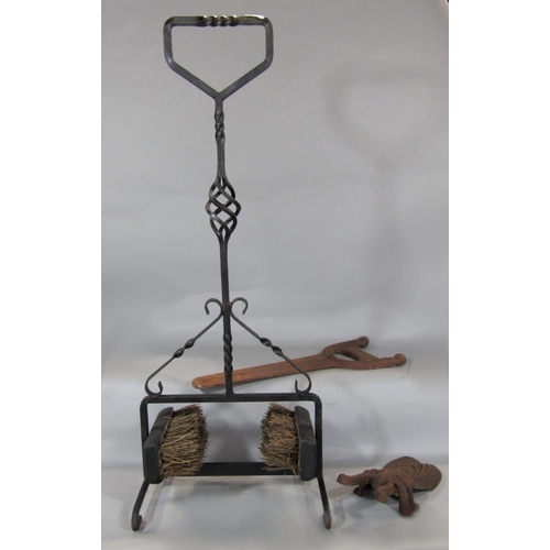 540 - Wrought iron hall boot brush, 84cm high, together with a further cast iron study of a beetle and one... 