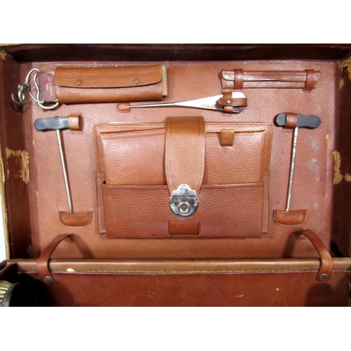 546 - A large leather vanity/dressing case, fitted with a collection of silver topped glass bottles and le... 