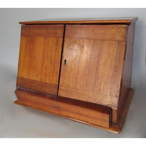 573 - Early 20th century mahogany medical cabinet, the twin doors enclosing two apothecary bottles and a f... 