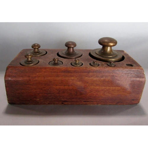 575 - Set of Ibrasco weighing scales, together with two graduated sets of brass weights fitted with mahoga... 