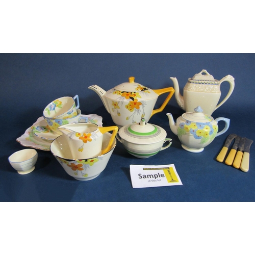 1119 - A collection of Crown Ducal sunburst pattern Art Deco teawares including teapot, milk jug, sugar bow... 