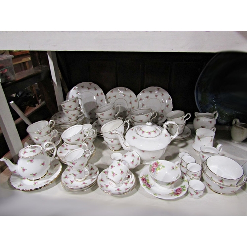 1122 - A collection of Roslyn china tea and coffeewares with printed rose decoration,  including similar Ro... 