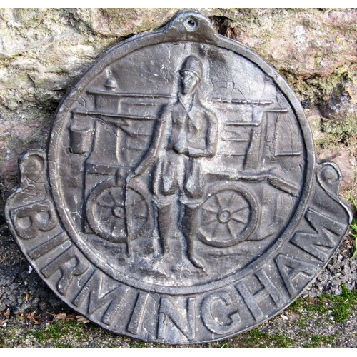 2095 - An antique lead Birmingham circular fire insurance plaque, with raised relief of a fireman with cart... 